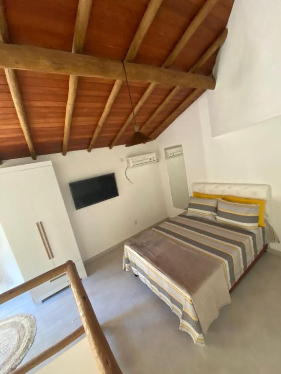 Ένα ή περισσότερα κρεβάτια σε δωμάτιο στο Chalés D'Lis