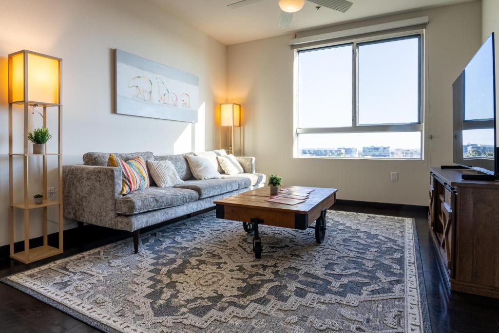 a living room with a couch and a coffee table at Luxury Apartment West Hollywood in Los Angeles