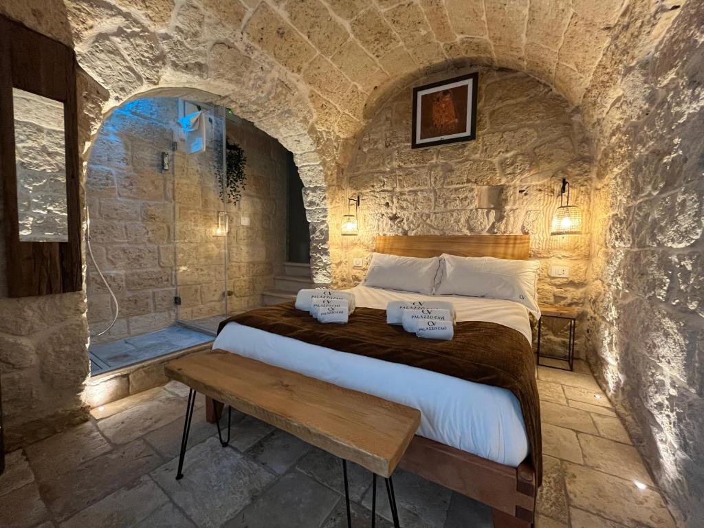 Postel nebo postele na pokoji v ubytování PALAZZO CAVÌ
