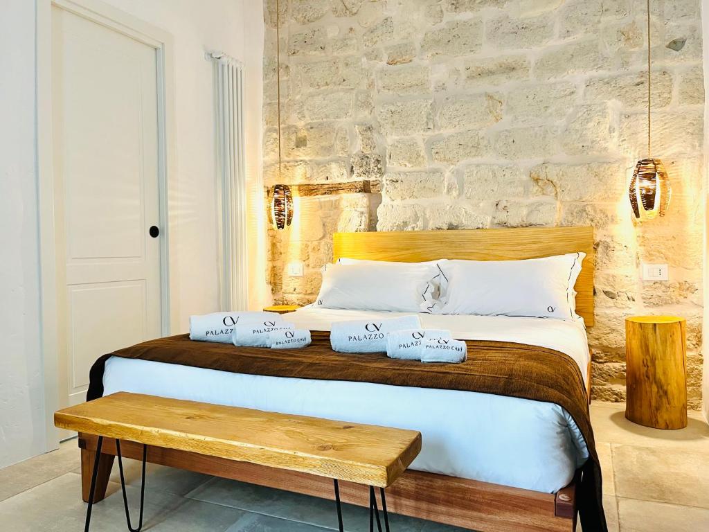 Postel nebo postele na pokoji v ubytování PALAZZO CAVÌ