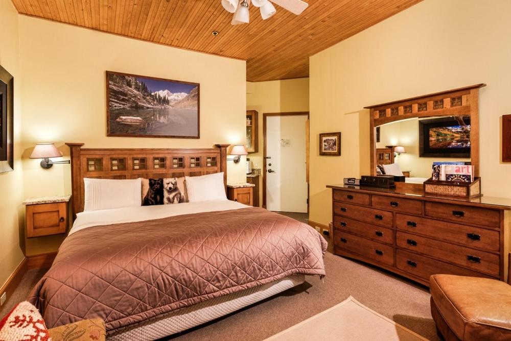 a bedroom with a large bed and a dresser at Independence Square Unit 309, Downtown Hotel Room with A/C in Aspen, Wet Bar & More in Aspen