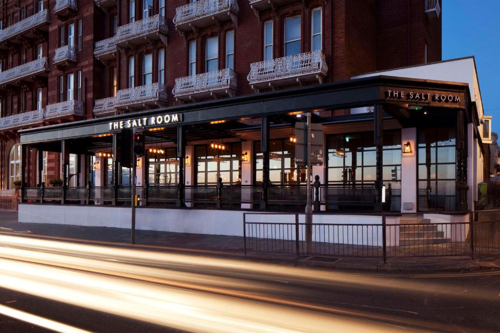 a street view of a building with a restaurant at DoubleTree By Hilton Brighton Metropole in Brighton & Hove