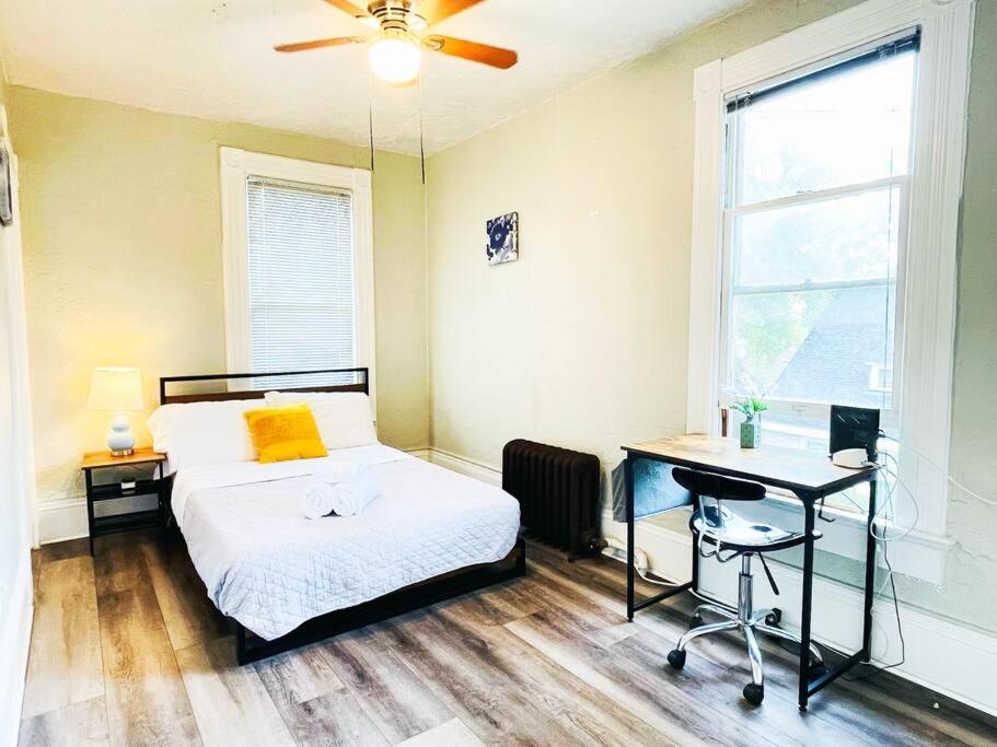 a bedroom with a bed and a desk and a window at #6 Studio/ Downtown San Jose/Parking/laundry/SJSU in San Jose
