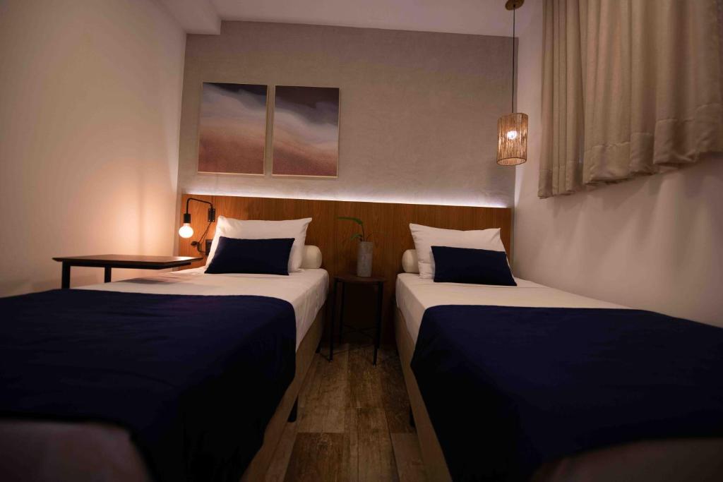 Krevet ili kreveti u jedinici u objektu Leblon Design Hotel