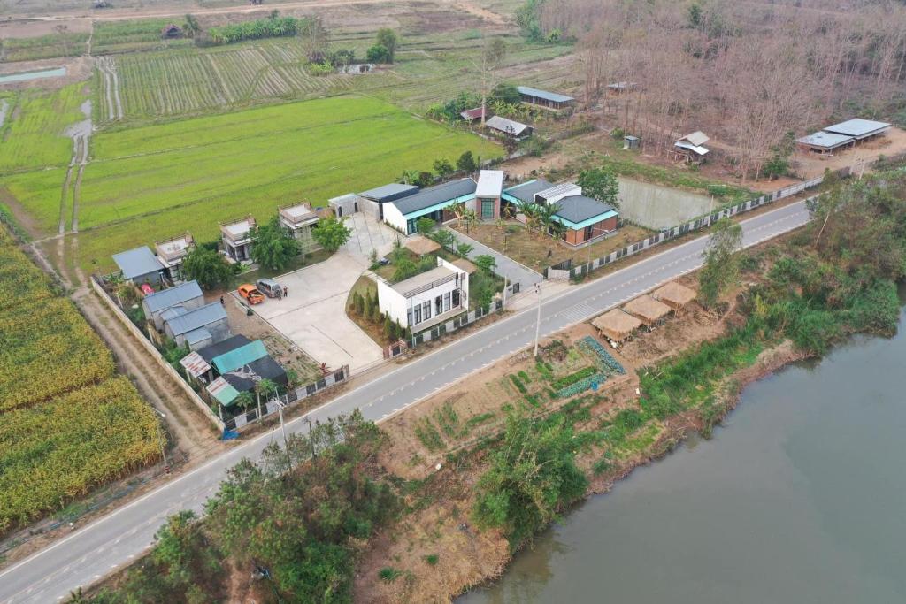an aerial view of a house next to a road at ริมยมรีสอร์ท in Ban Wang Din