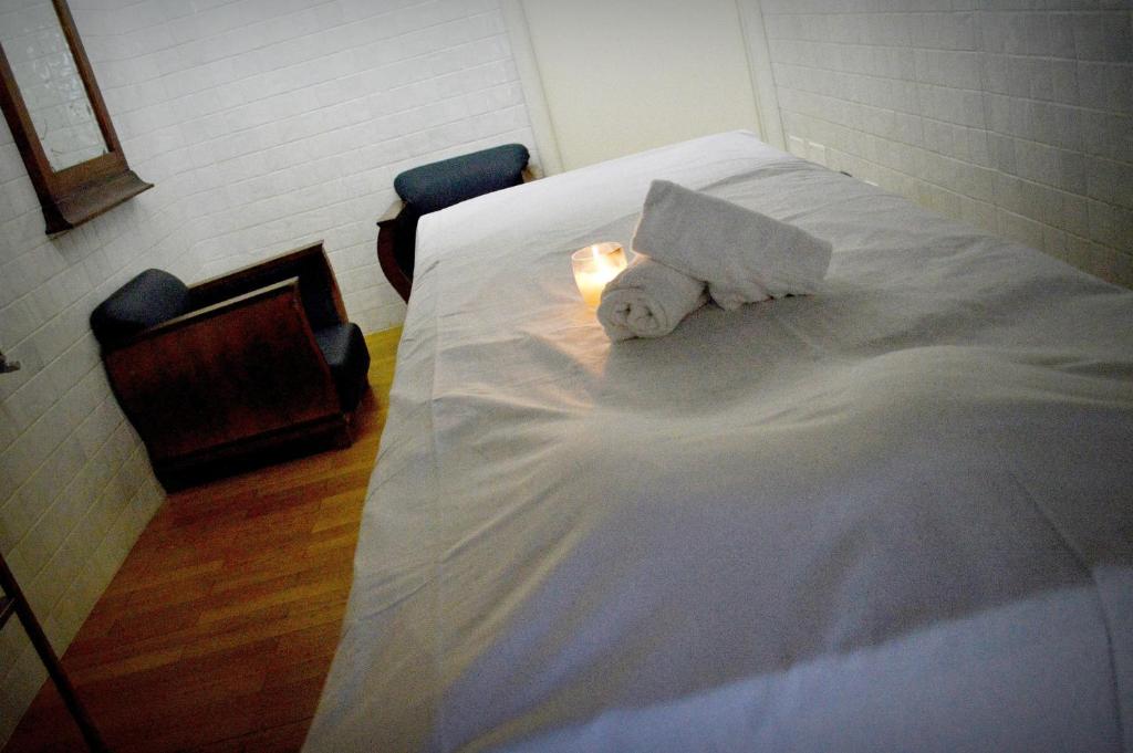 Postel nebo postele na pokoji v ubytování Foro Appio Mansio Hotel