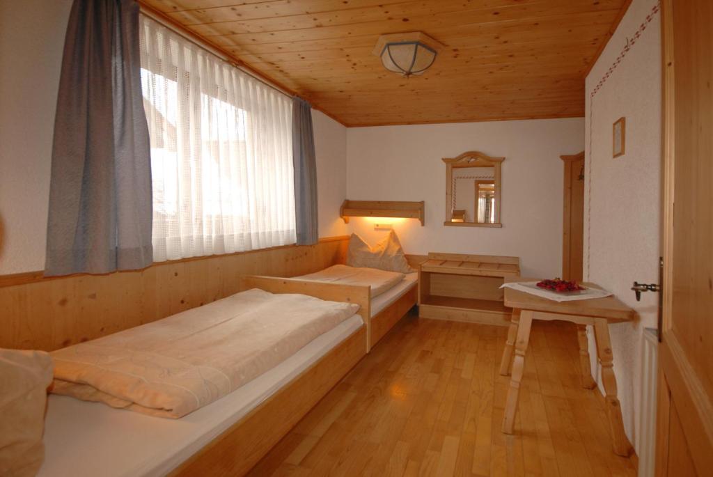 Postel nebo postele na pokoji v ubytování Frühstücks- & Apartmenthaus Maislau