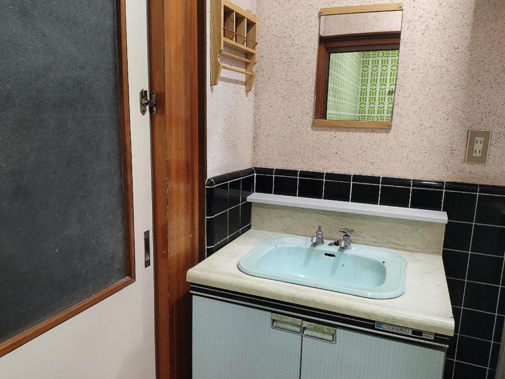 Koupelna v ubytování Guesthouse Kincha 駅東口