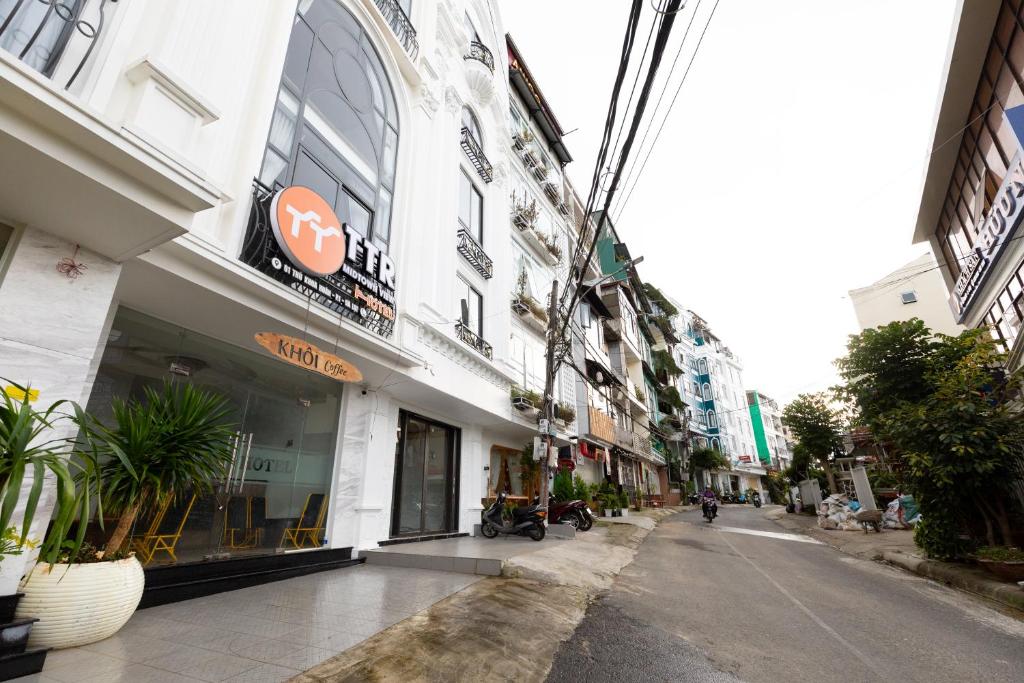 an empty street in a city with buildings at TTR Midtown View Hotel in Da Lat