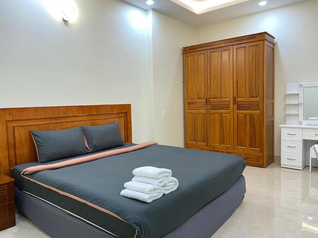 Postel nebo postele na pokoji v ubytování Da Quy Harmony Homestay