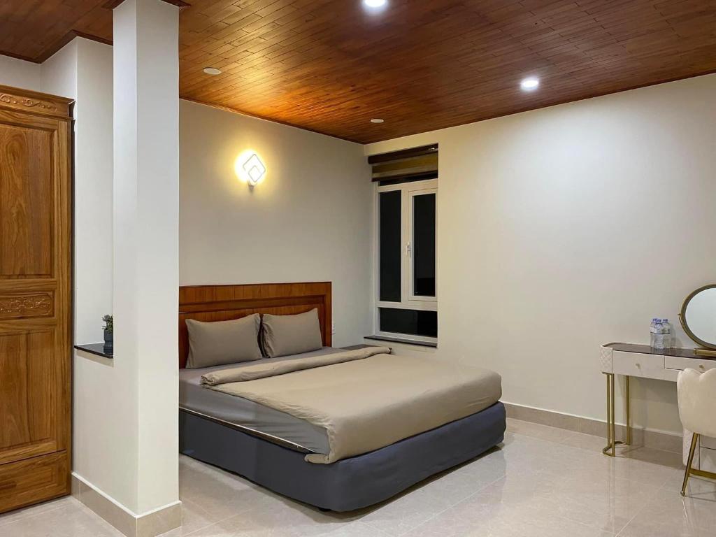 Postel nebo postele na pokoji v ubytování Da Quy Harmony Homestay