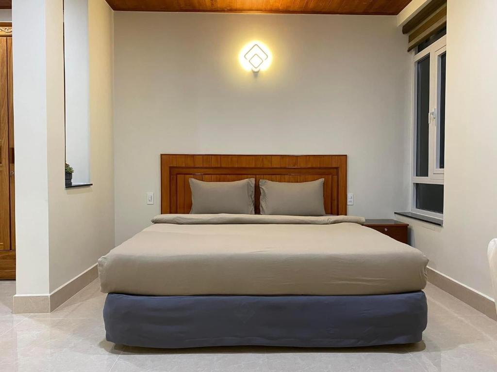 Postel nebo postele na pokoji v ubytování Da Quy Harmony Homestay