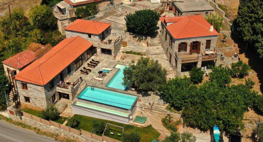 an aerial view of a house with a swimming pool at The House of Prince in Nea Stira