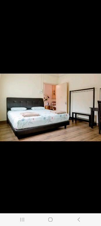 Postel nebo postele na pokoji v ubytování Ming Yuan Homestay