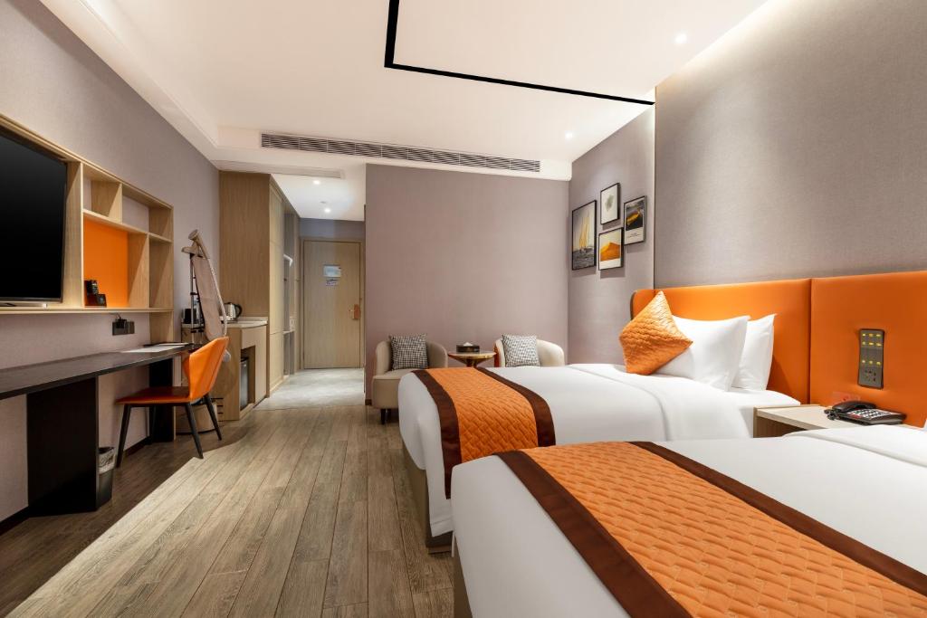 Postel nebo postele na pokoji v ubytování Guangzhou Yunjia Hotel - Airport Terminal 2