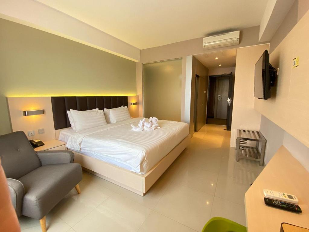 Postel nebo postele na pokoji v ubytování Classie Hotel