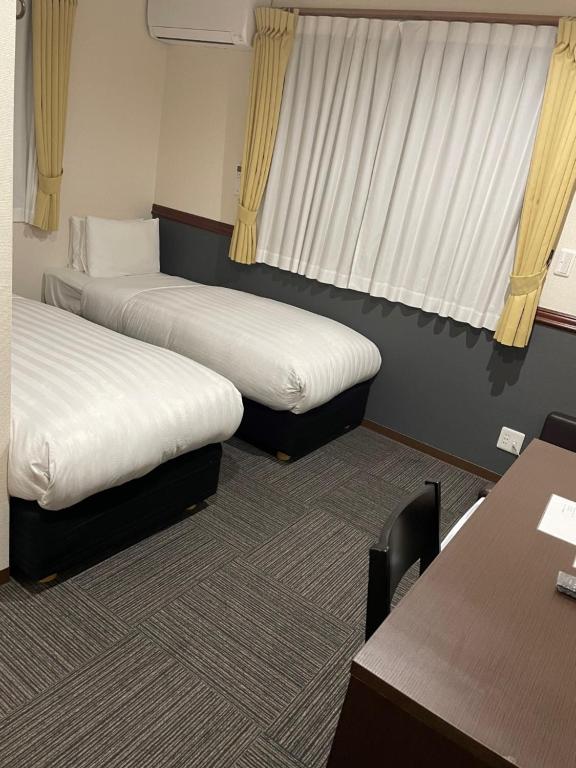 Postel nebo postele na pokoji v ubytování Karin doo Hotel