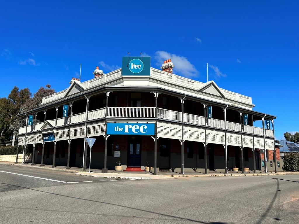 a large building on the corner of a street at The Rec Hotel in Northam