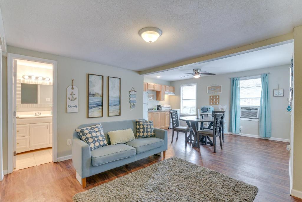 a living room with a couch and a table at Walk to Beach Cozy Unit in Galveston! in Galveston