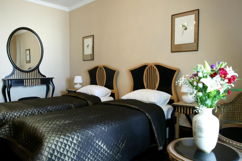 Postel nebo postele na pokoji v ubytování Arena Regia Hotel & Spa - Marina Regia Residence