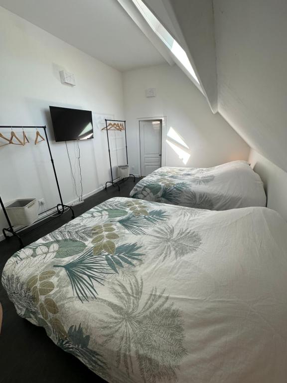 Ein Bett oder Betten in einem Zimmer der Unterkunft Le Domaine Neuf