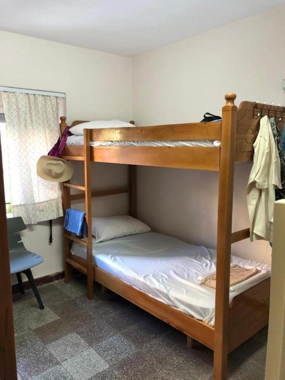 Postel nebo postele na pokoji v ubytování ROYAL 3 Hostel Opposite NALU BAR