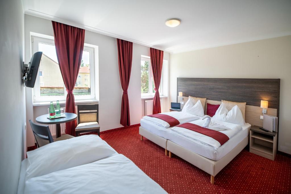 Voodi või voodid majutusasutuse Hotel Marc Aurel toas