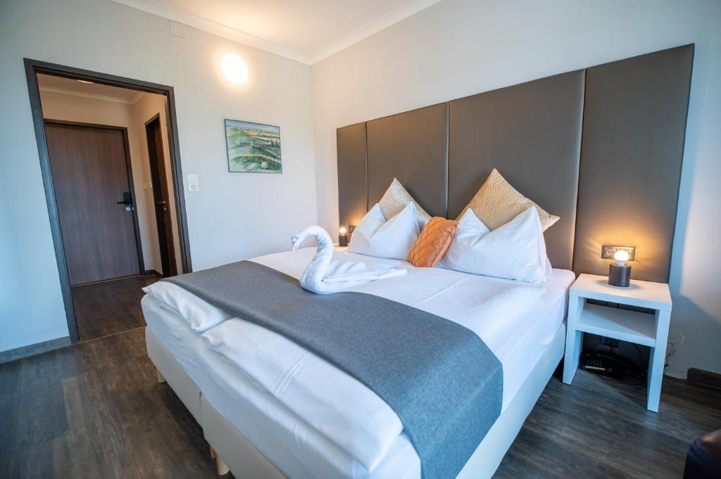 Voodi või voodid majutusasutuse Hotel Marc Aurel toas