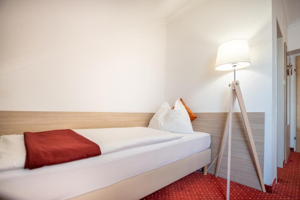 Voodi või voodid majutusasutuse Hotel Marc Aurel toas
