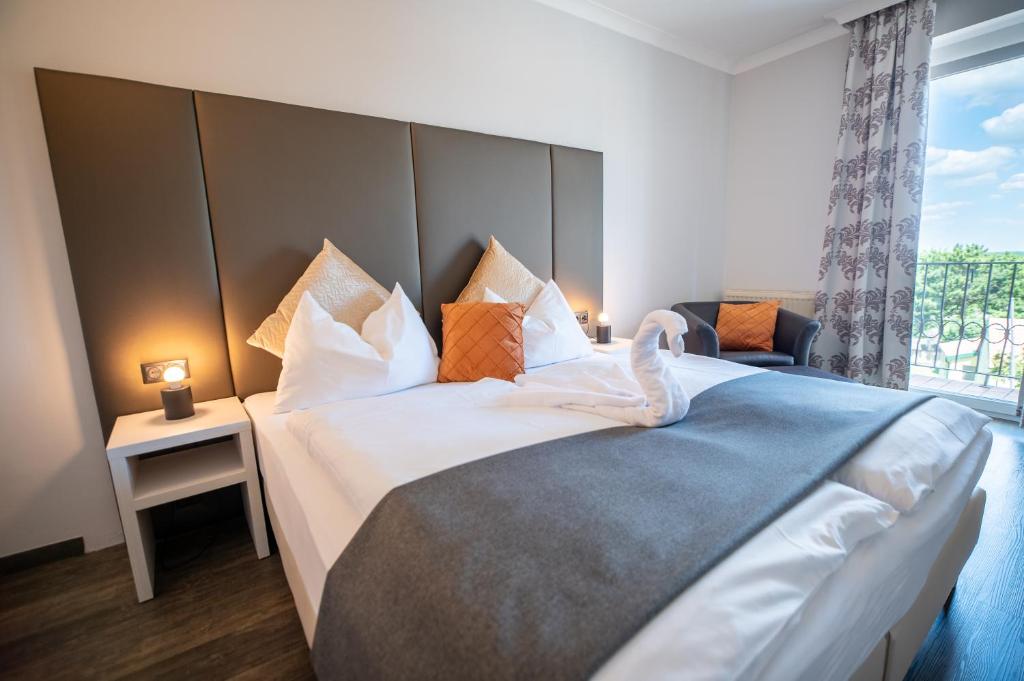 Voodi või voodid majutusasutuse Hotel Marc Aurel toas