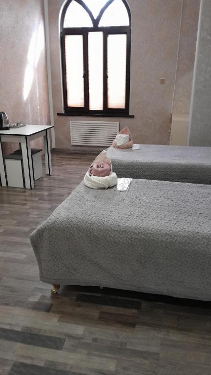 Delfin Guest House tesisinde bir odada yatak veya yataklar