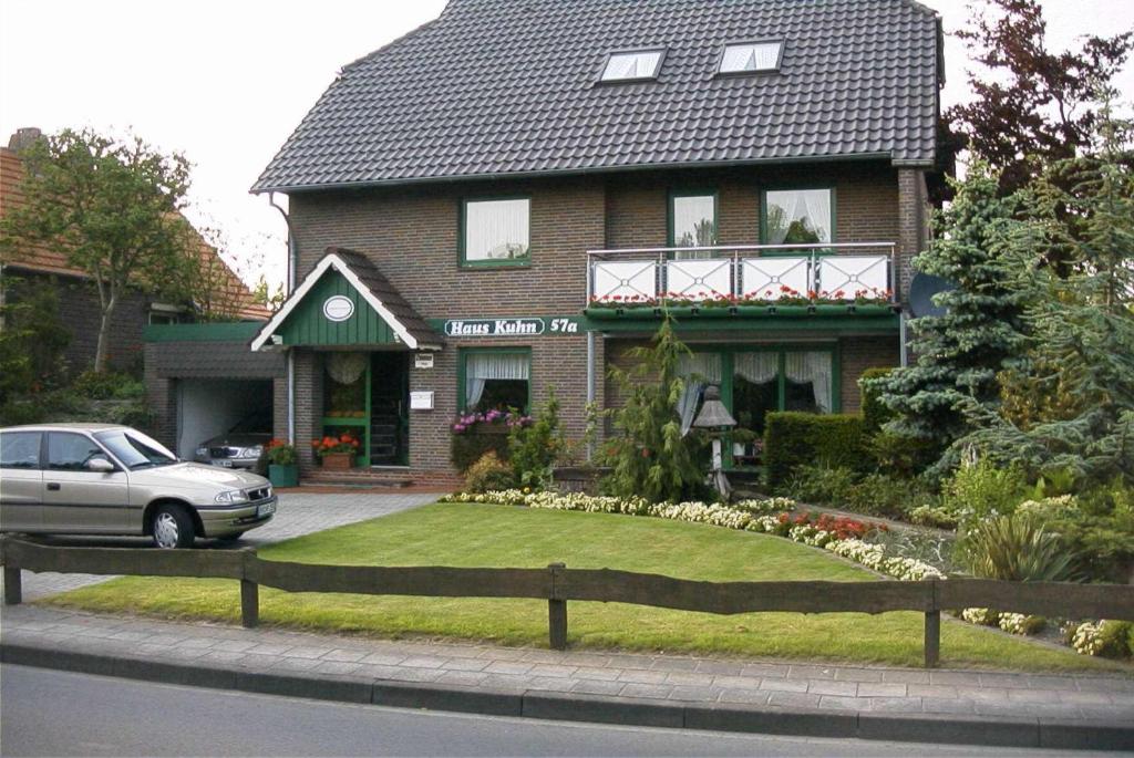 a house with a lawn in front of it at Haus Kuhn in Carolinensiel
