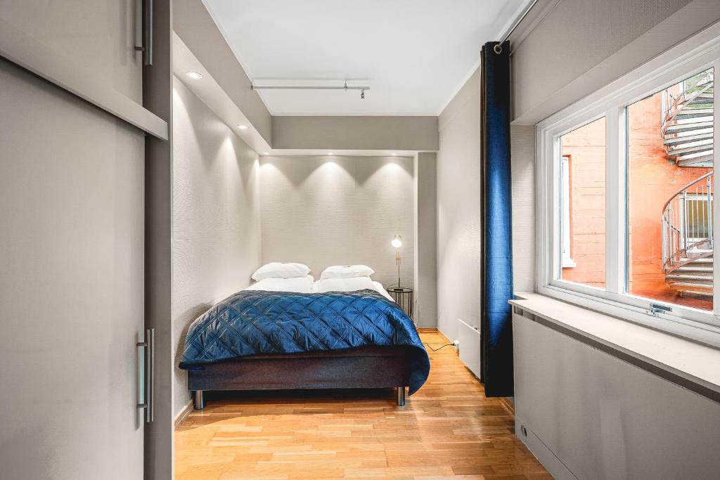 Postel nebo postele na pokoji v ubytování Enter Amalie Apartment Hotel