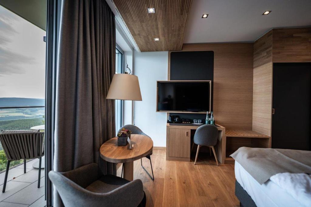 TV a/nebo společenská místnost v ubytování Kulmberghaus Resort