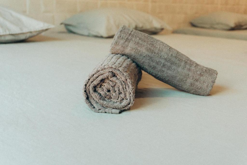 a bed with a towel on the top of it at Apartamentos La Ruta in Calpe