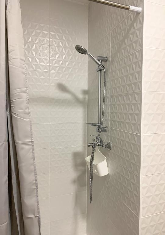 a shower with a glass door in a bathroom at Apartamentos La Ruta in Calpe