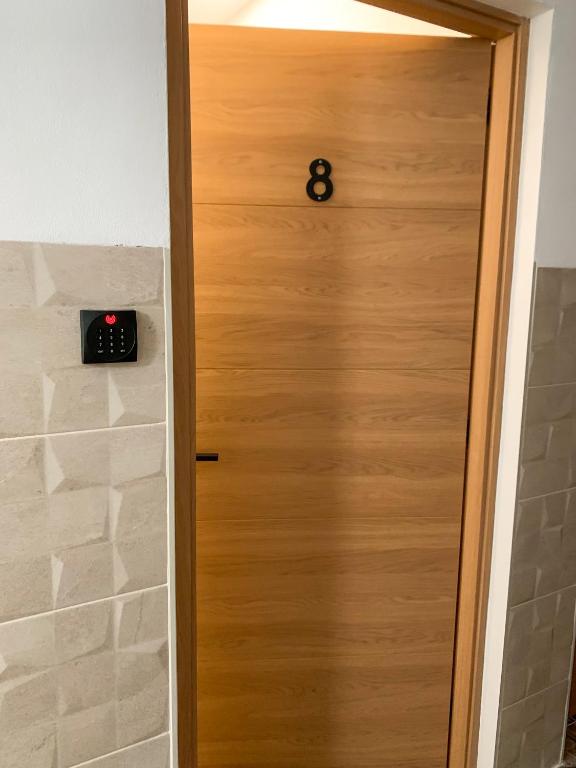 a door with a clock on top of it at Apartamentos La Ruta in Calpe