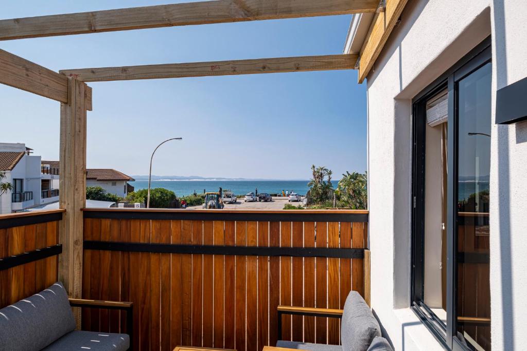a balcony with a view of the ocean at SALT in Jeffreys Bay