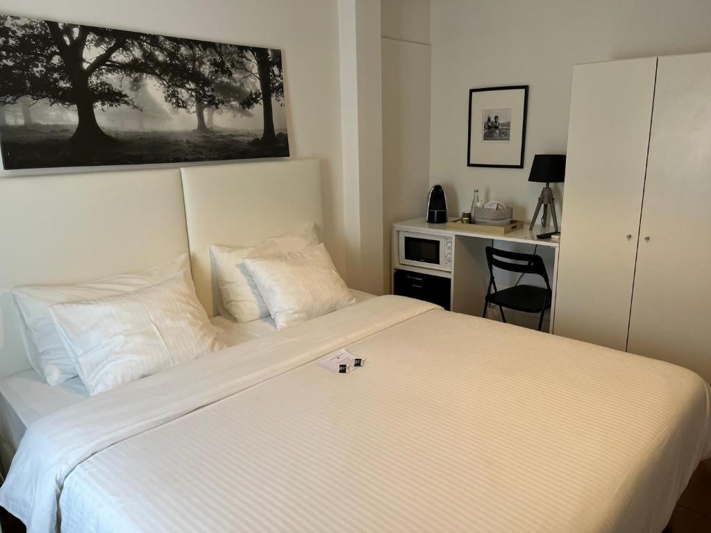 Postel nebo postele na pokoji v ubytování HOTEL BOUTIQUE a ESPLANADA