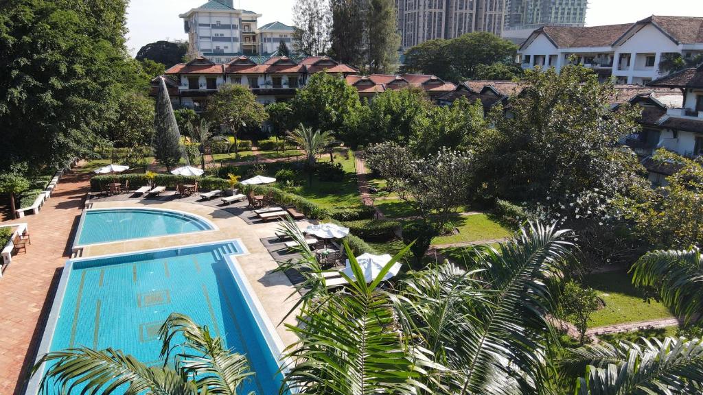 an aerial view of a resort with a swimming pool at Les Jardins Du Bassac in Phnom Penh