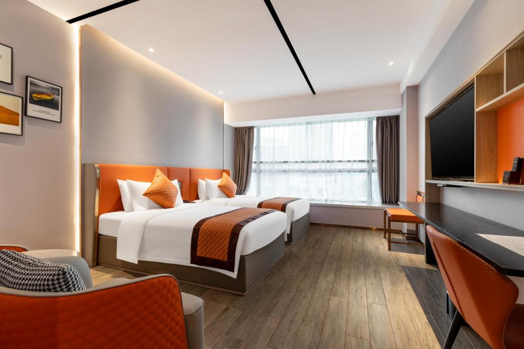 Postel nebo postele na pokoji v ubytování Guangzhou Yunjia Hotel - Airport Terminal 2