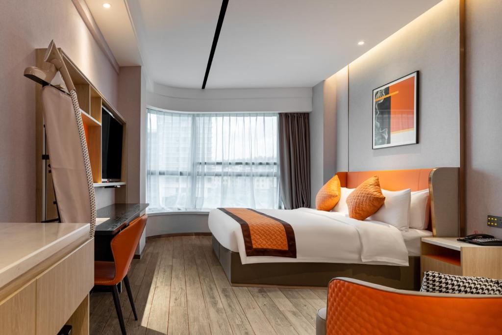 Postel nebo postele na pokoji v ubytování Guangzhou Yunjia Hotel - Airport Terminal 2