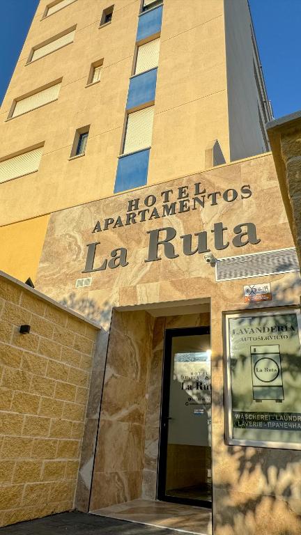 a building with a sign that reads la ruta at Apartamentos La Ruta in Calpe