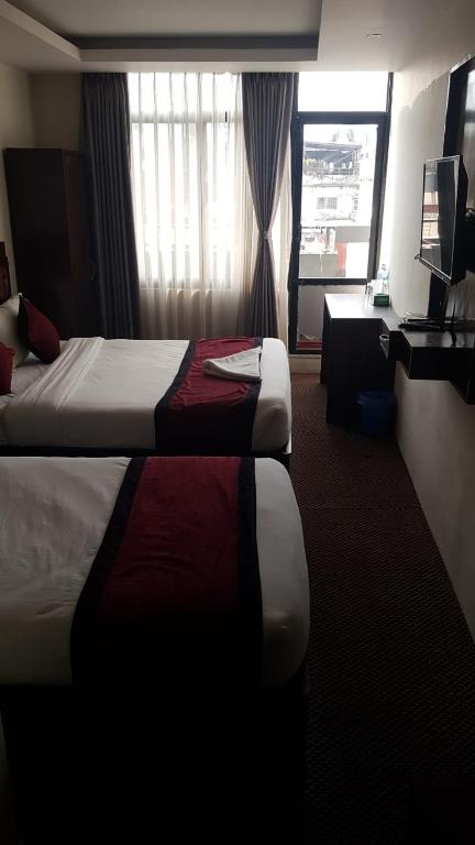 Postel nebo postele na pokoji v ubytování Hotel de Universal
