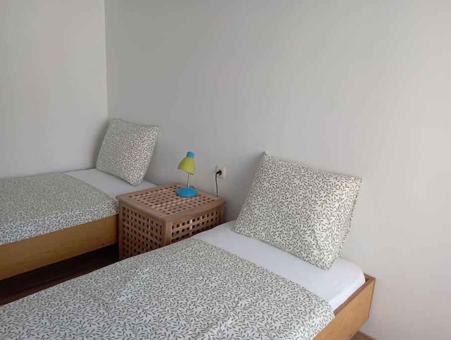 Säng eller sängar i ett rum på Gradina Apartment