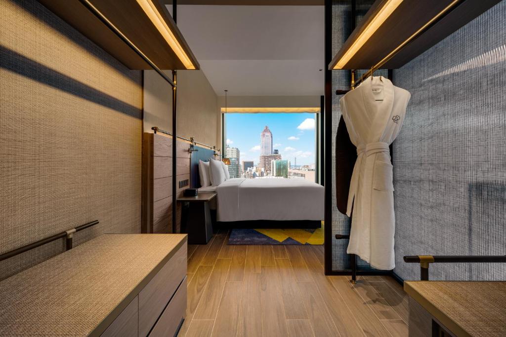 A bed or beds in a room at Hotel Resonance Taipei, Tapestry Collection by Hilton