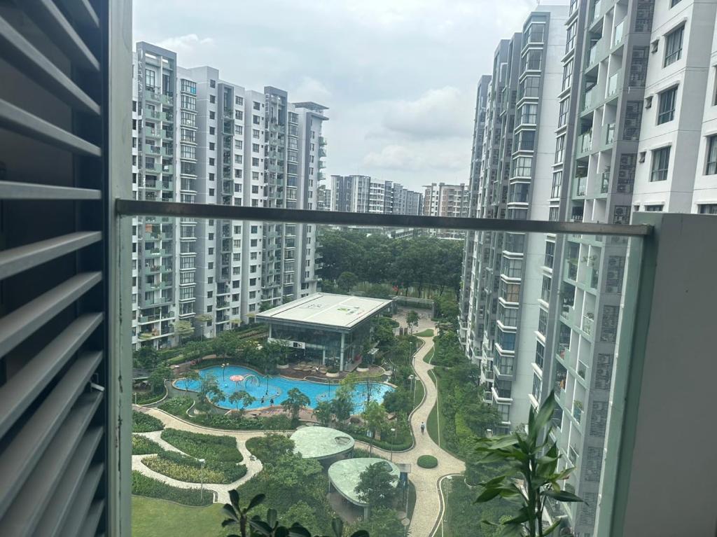 a view of a pool from a window of a building at Căn hộ 2pn2wc Celadon City Aeon Mall Tân Phú in Ho Chi Minh City