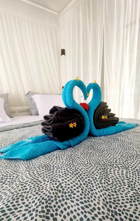 Postel nebo postele na pokoji v ubytování Tiki Boutique Hotel Spa Lombok
