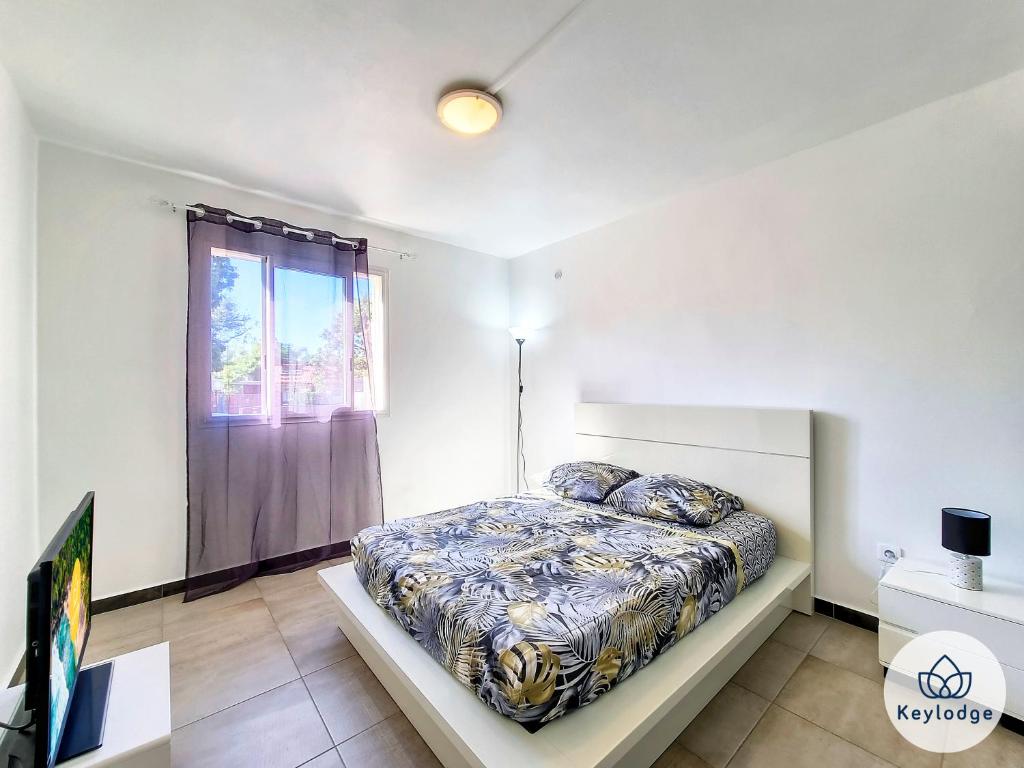 Llit o llits en una habitació de Zambaville - maison 2 chambres - Sainte-Anne