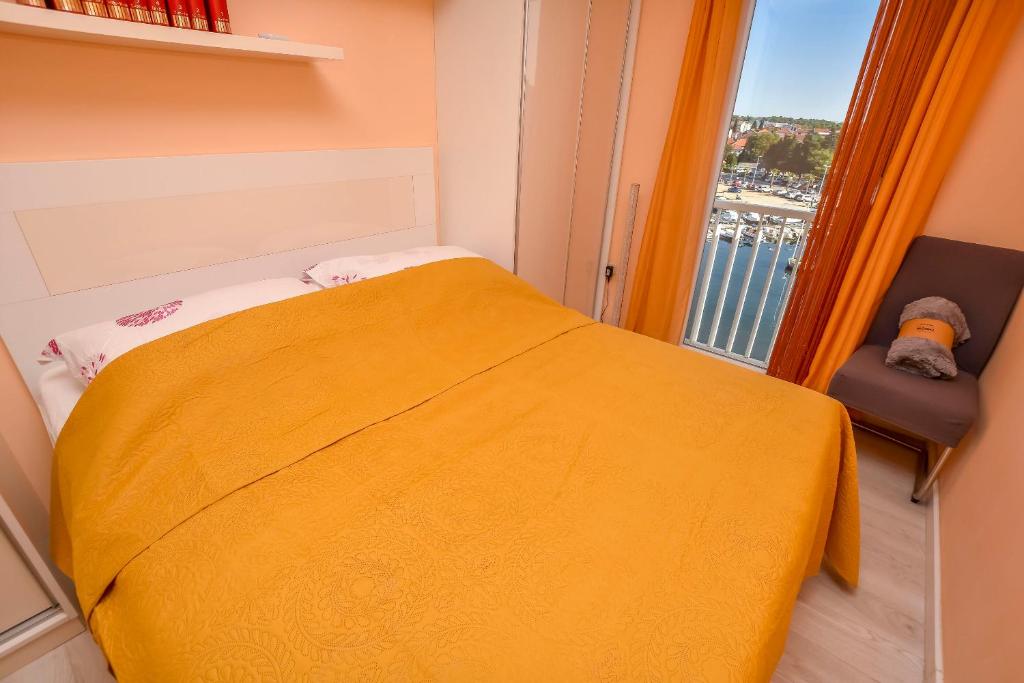 Postel nebo postele na pokoji v ubytování Apartments Vongola